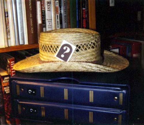 John R. Bacak uses his tattoo in his hat (2002)